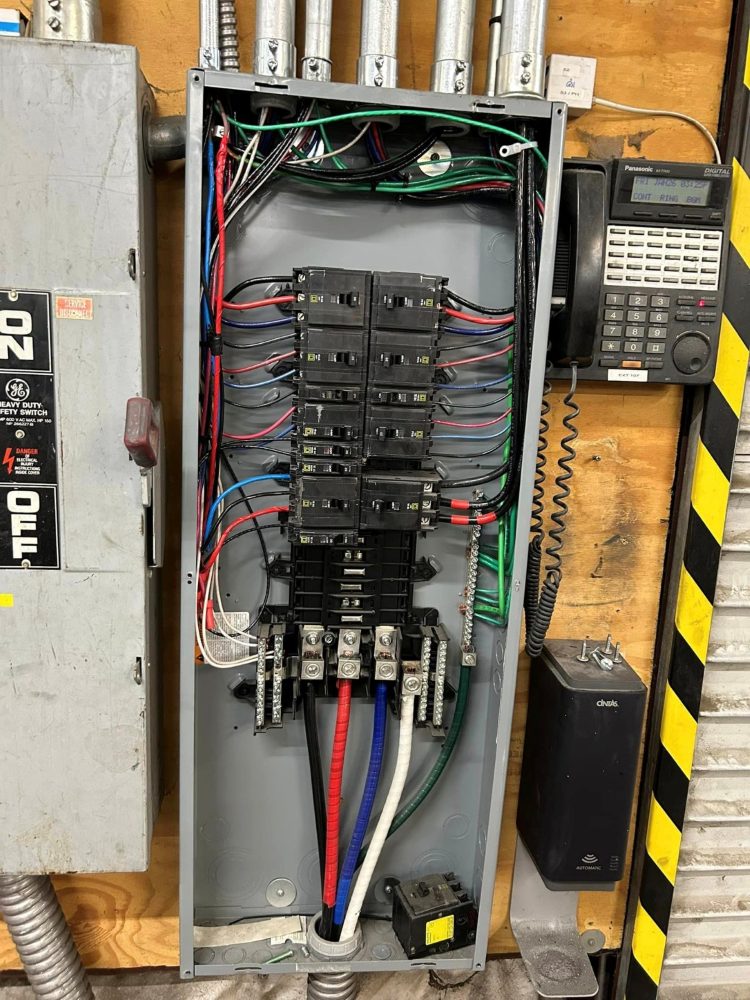 Three-phase panel with the dead front off and conductors dressed in