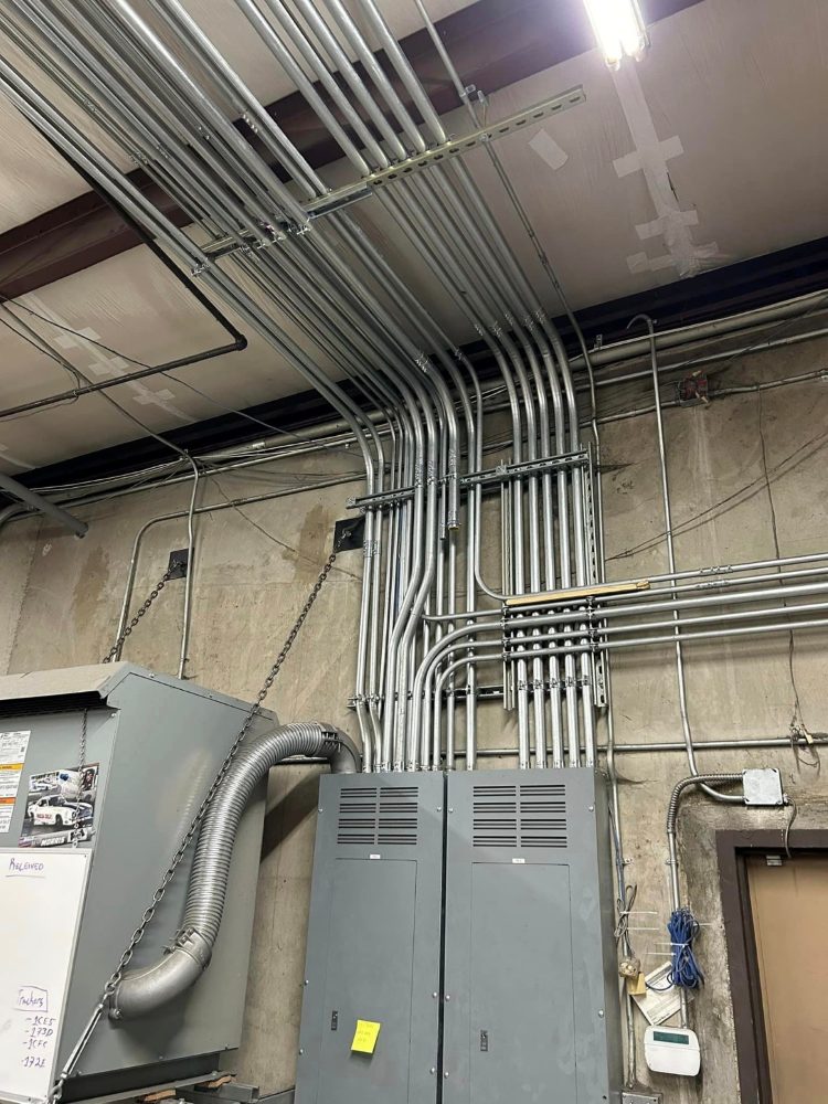 Bank of conduit feeding distribution panels inside the shop