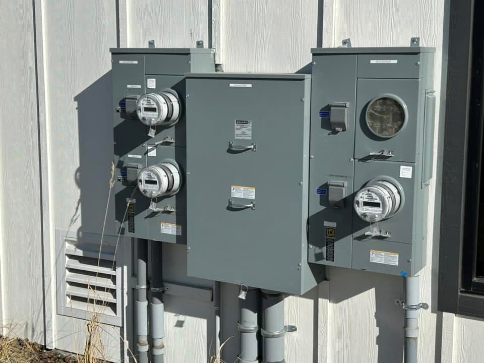 Multi-meter service gear and conduit on the exterior wall