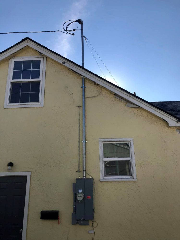 Overhead service upgrade with new mast and meter main